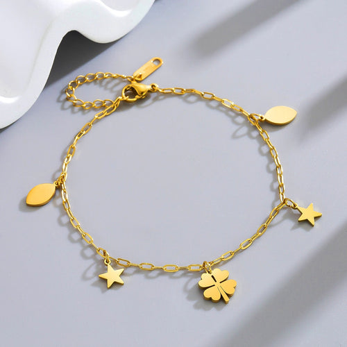 Tobillera de acero titanio con colgante de flor de campana de cuatro pétalos bañada en oro de 18k